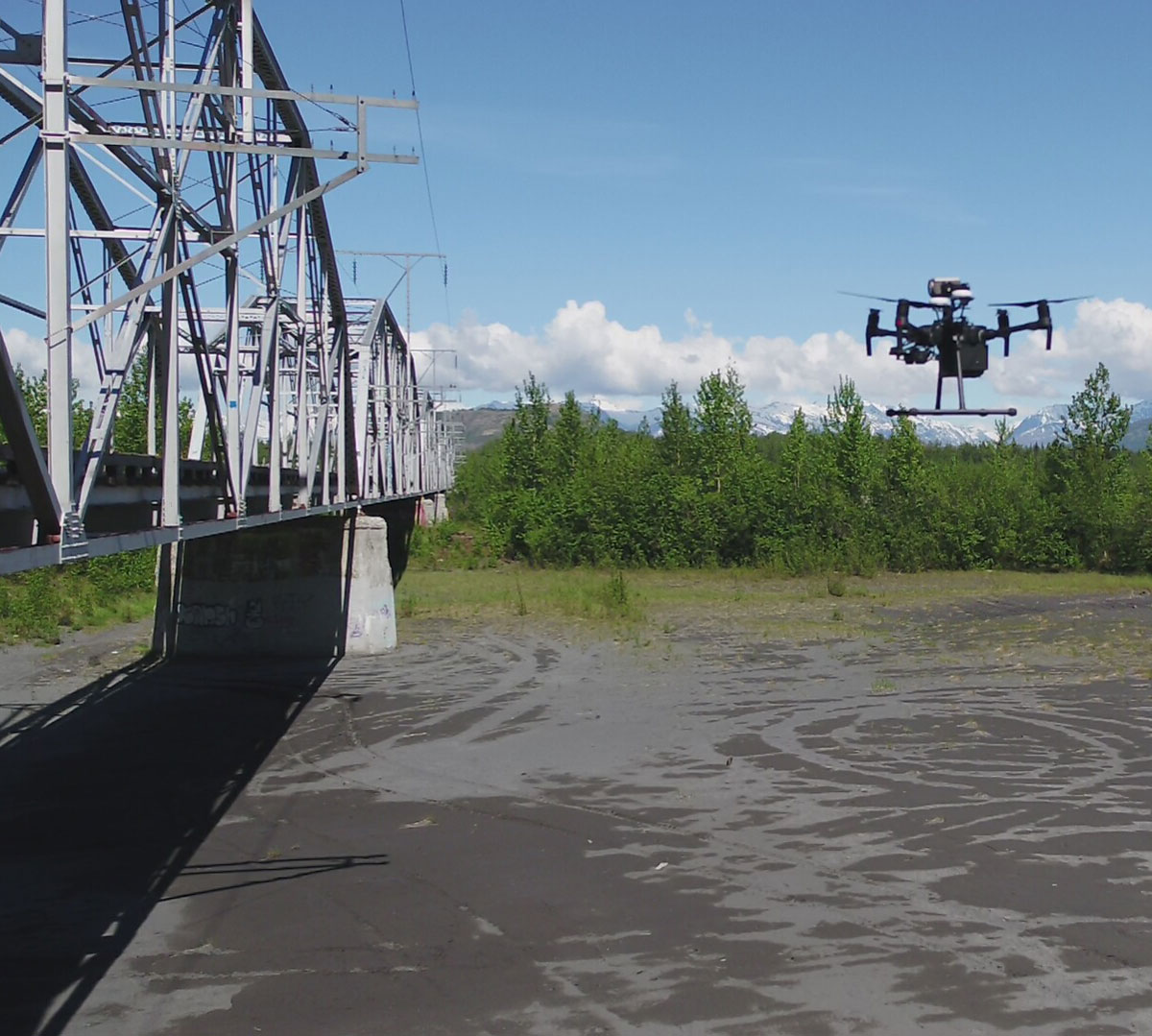 A F. Robert Bell & Associates drone inspects a bridge across the Matanuska Susitna River for potential weak spots
