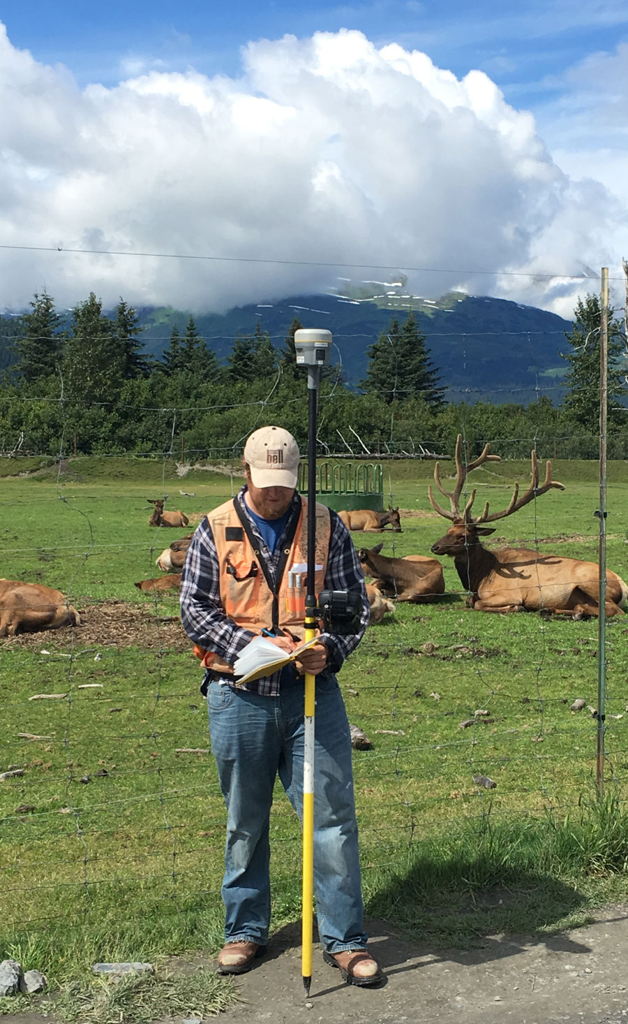 A F. Robert Bell & Associates surveyor collects data at the Alaska Wildlife Conservation Center in Portage along the Seward Highway