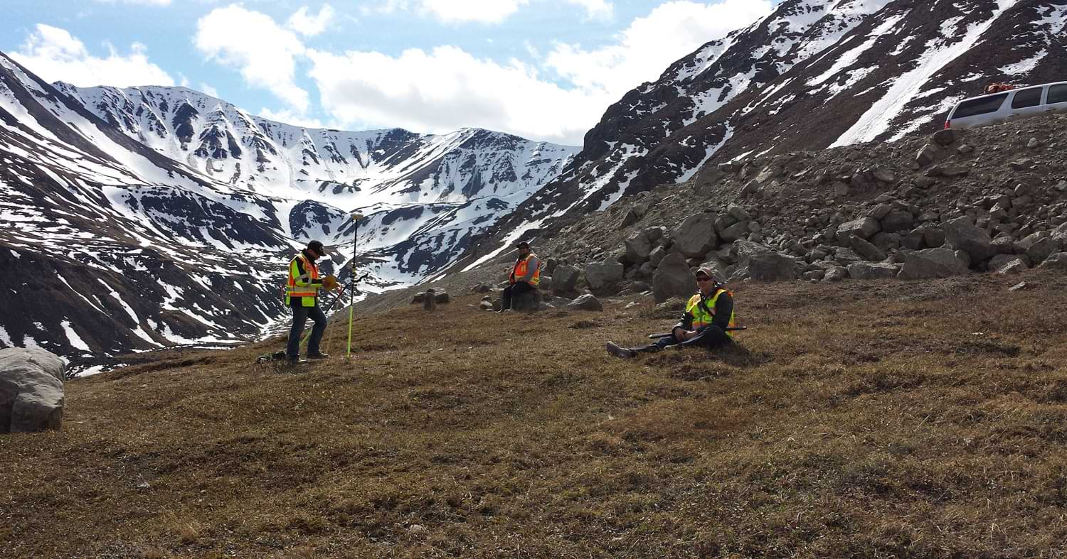 F. Robert Bell & Associates survey crews focus on a monument high in the Brooks Range in Alaska’s Arctic region