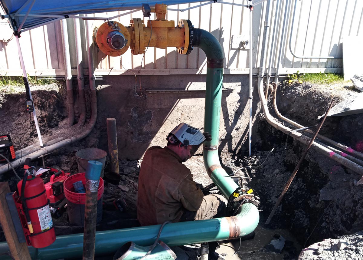 Bering Industrial’s lead welder works to attach the new fuel pipeline section