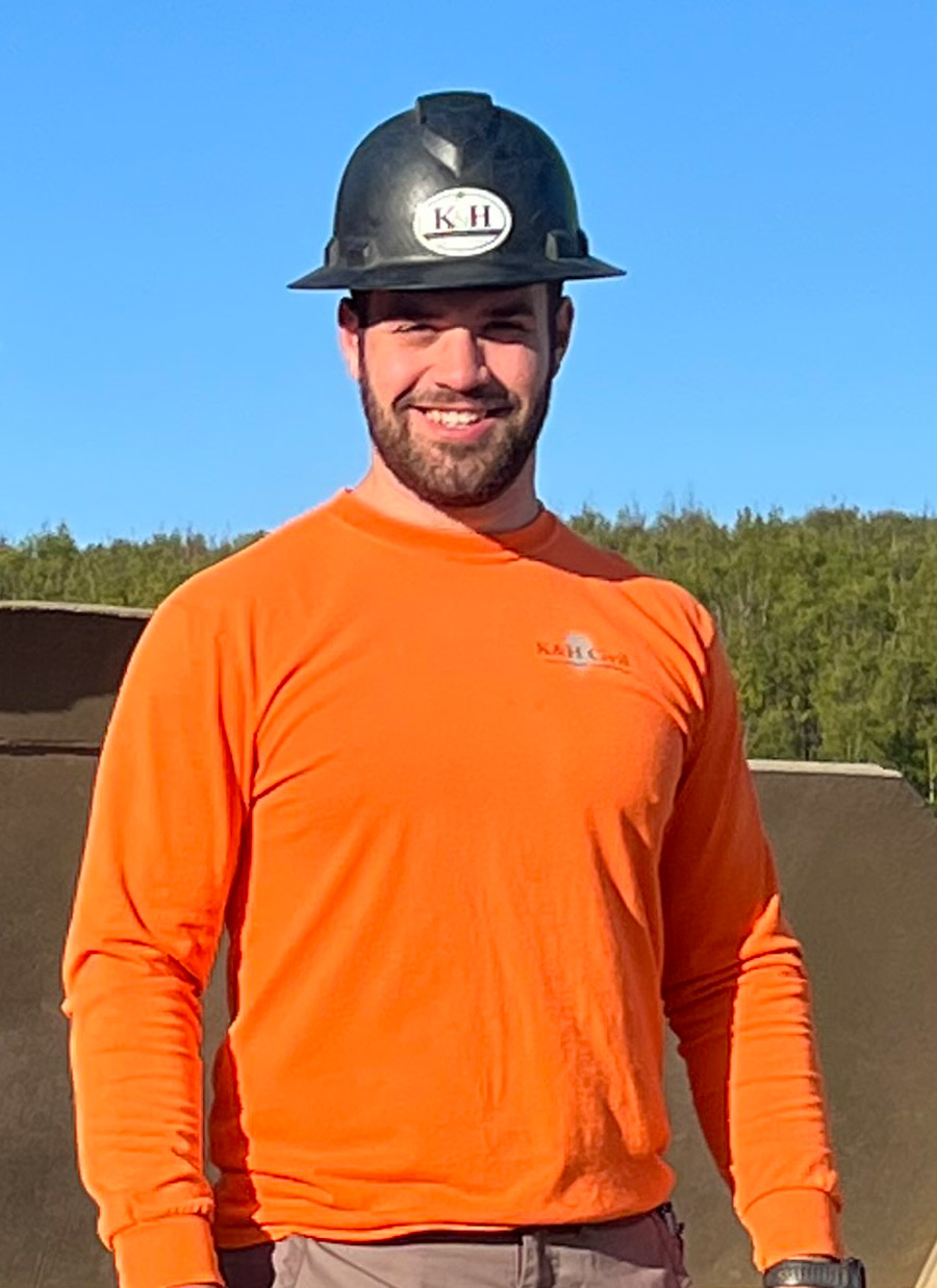 Jacob Hessinger in an orange long sleeve and a hard hat