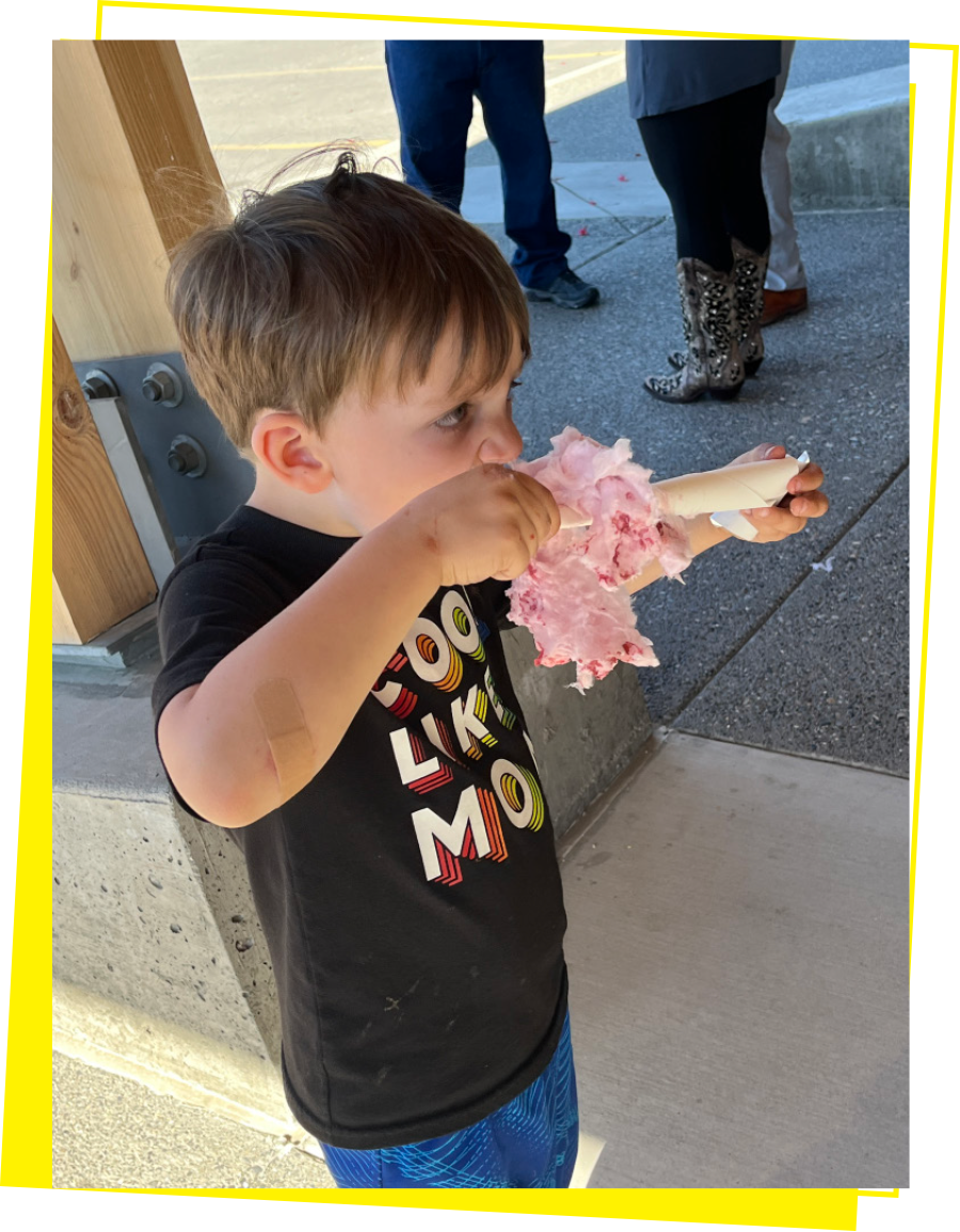 child eating cotton candy