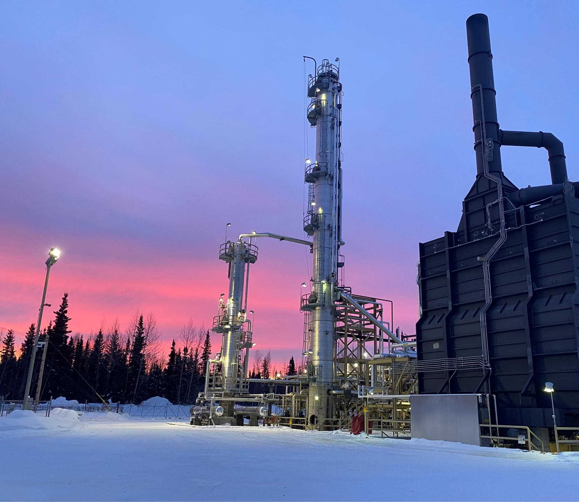 the North Pole Refinery Crude Unit against a pink and blue sky