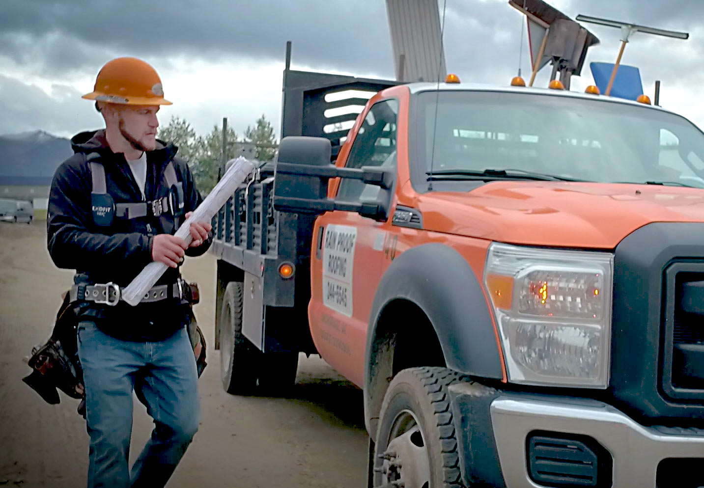 construction worker with orange truck