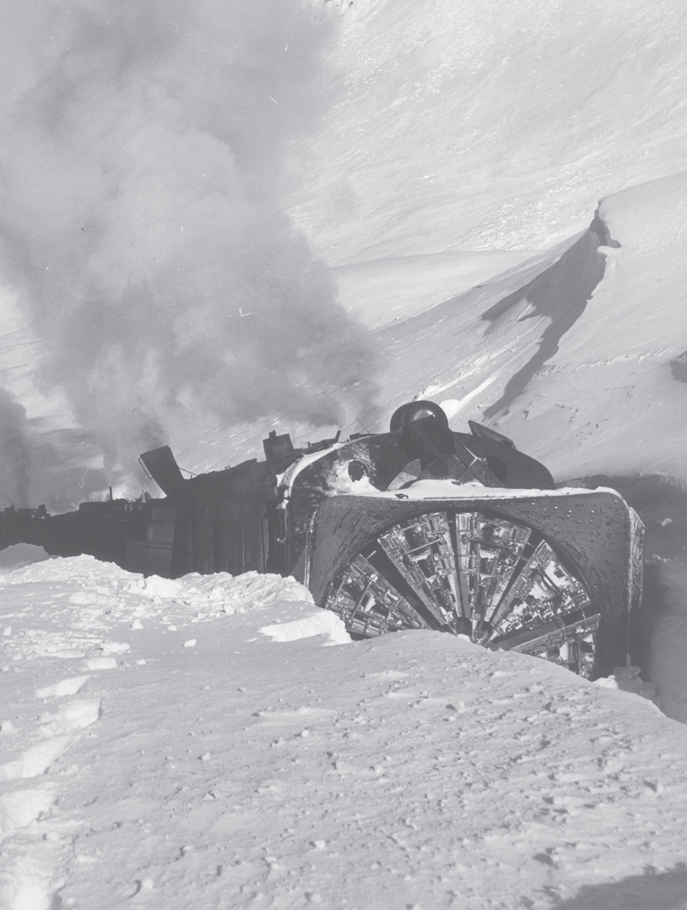 rotary snowplow clearing tracks in deep snow along Turnagain Arm