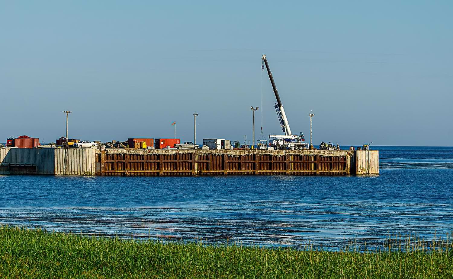 distant view of construction work taking place on the Eareckson Air Station's fuel pier