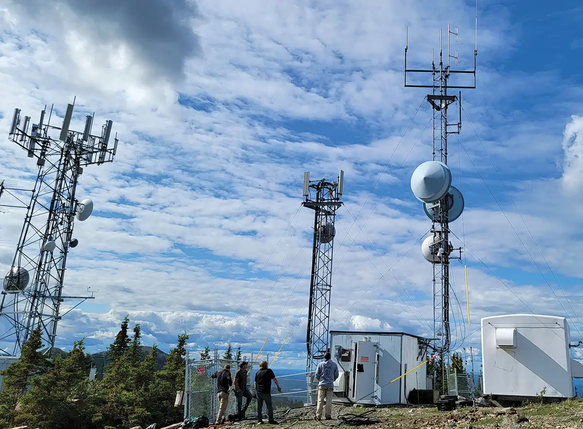 Articom crew inspecting the Alaska Land Mobile Radio Willow Mountain site tower
