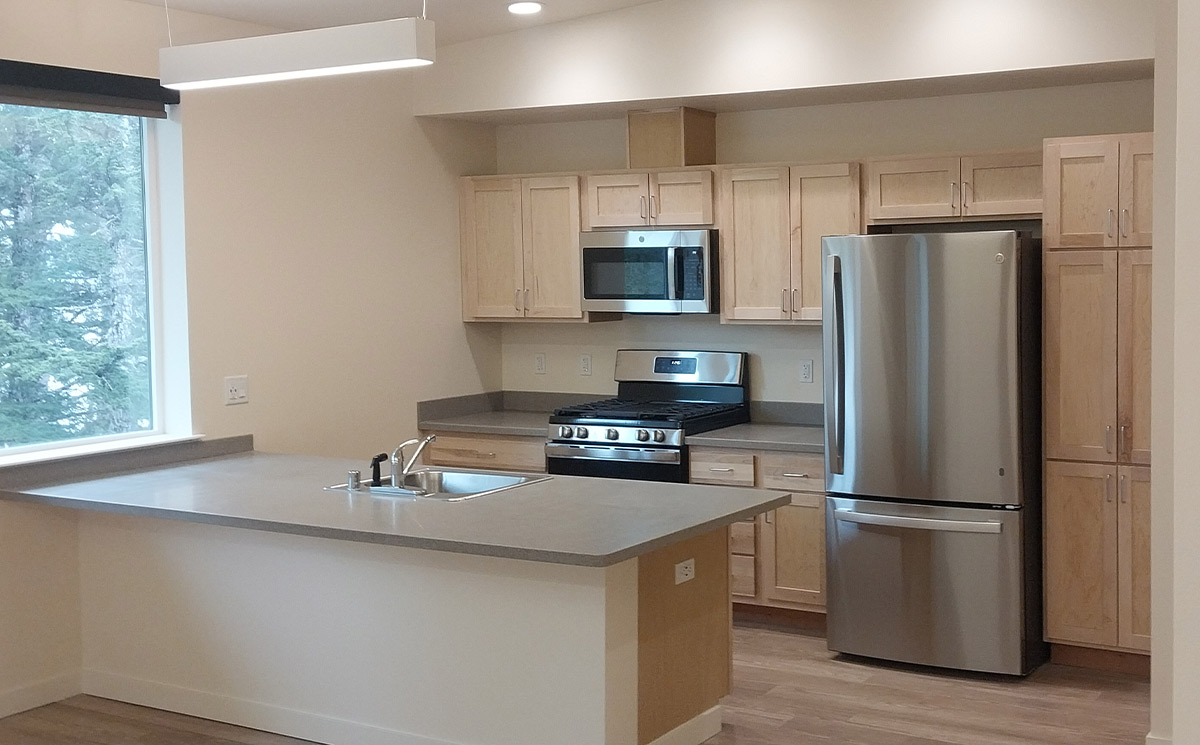 wide view of the fully equipped kitchen in one of the units of the new Chenega Multipurpose Housing Facility